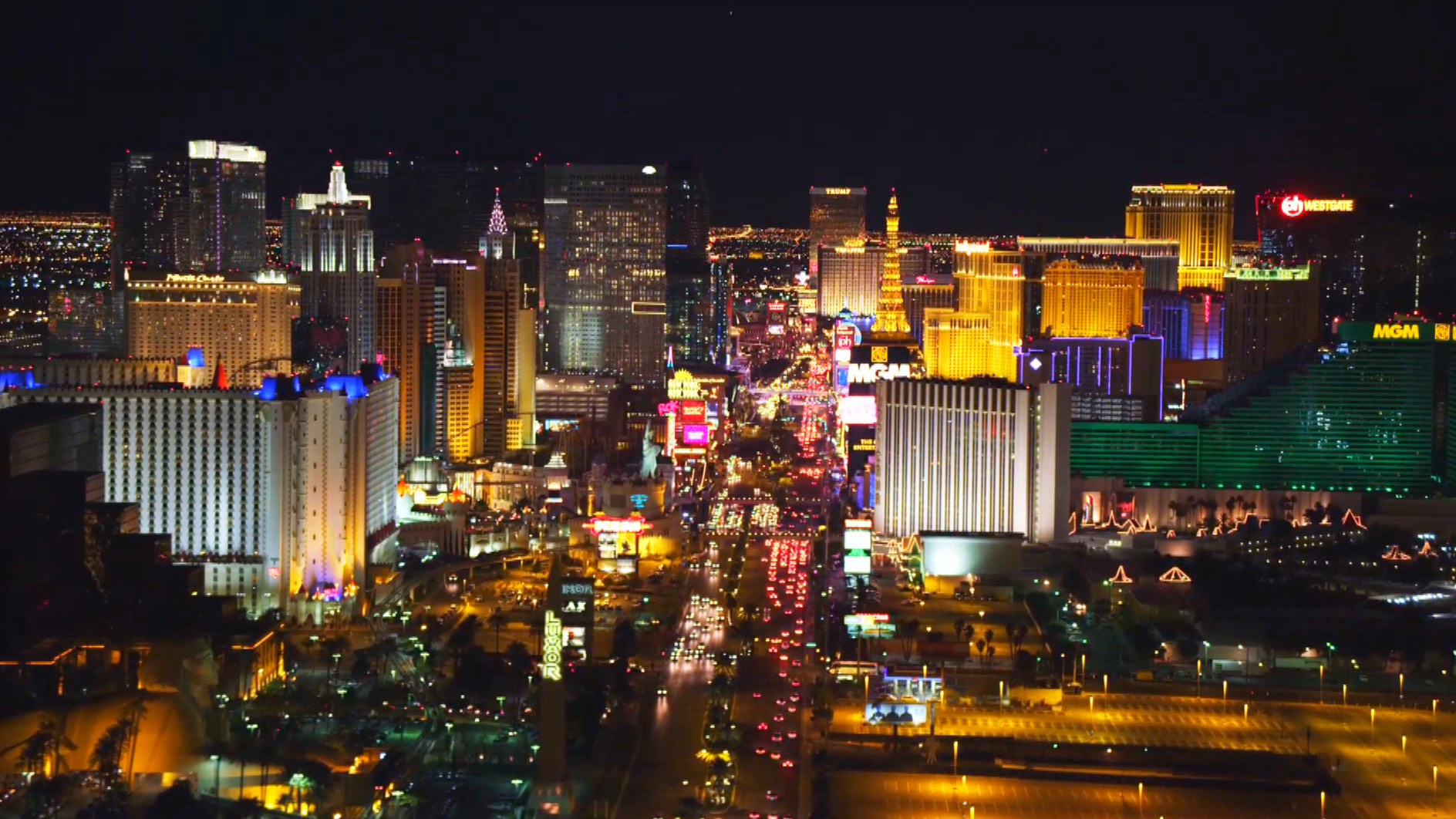 Aerial view of Las Vegas Strip at night, with brightly lit hotels and casinos lining the vibrant cityscape.