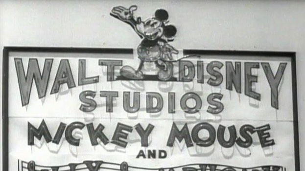 Black and white sign reading "Walt Disney Studios Mickey Mouse" with Mickey Mouse illustration on top.