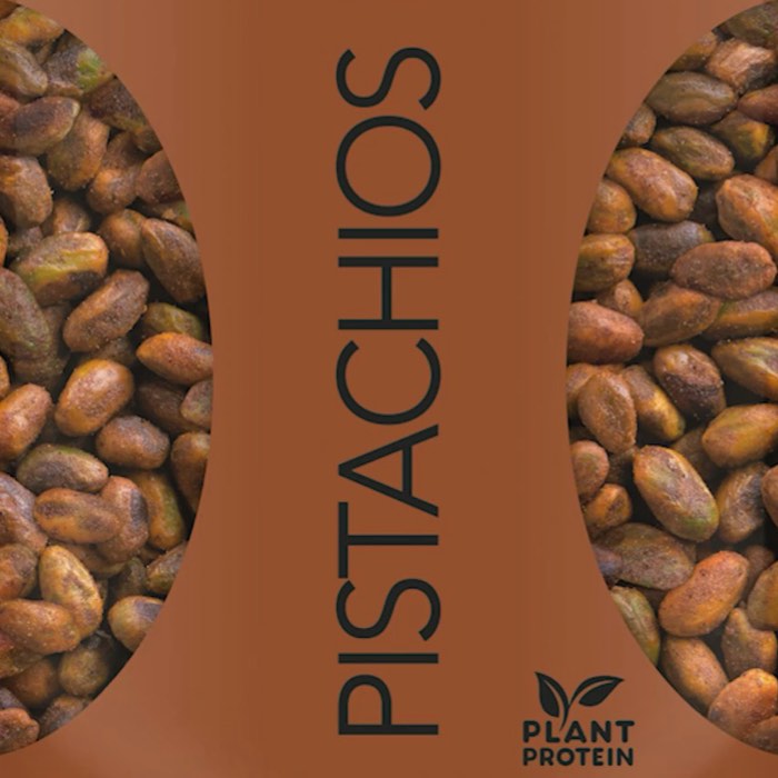 A close-up of shelled pistachios with "Pistachios" and "Plant Protein" text on a brown background.